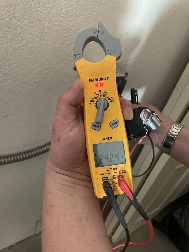 Voltage testing with clamp meter during Ceiling Fan Installation in Anna
